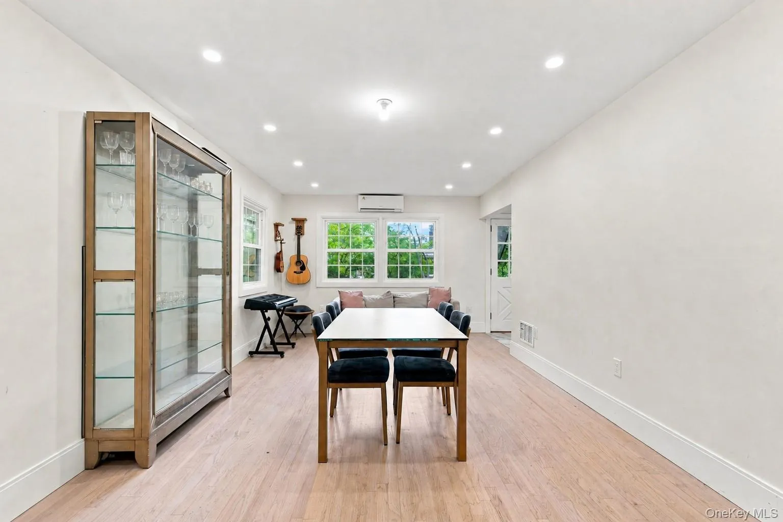 Recessed lighting illuminates the wood-finish flooring Recessed lighting illuminates the wood-finish flooring