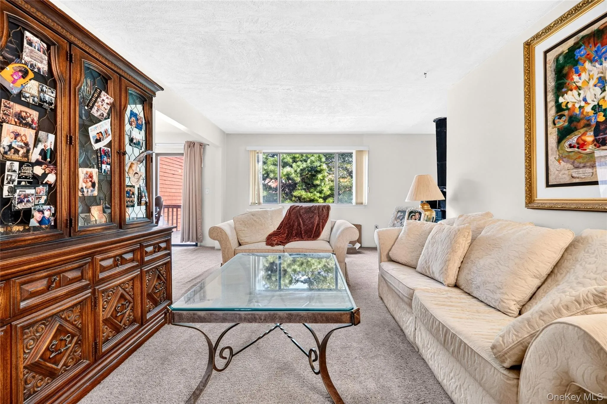 Living room with a large window and natural light. Living room with a large window and natural light.