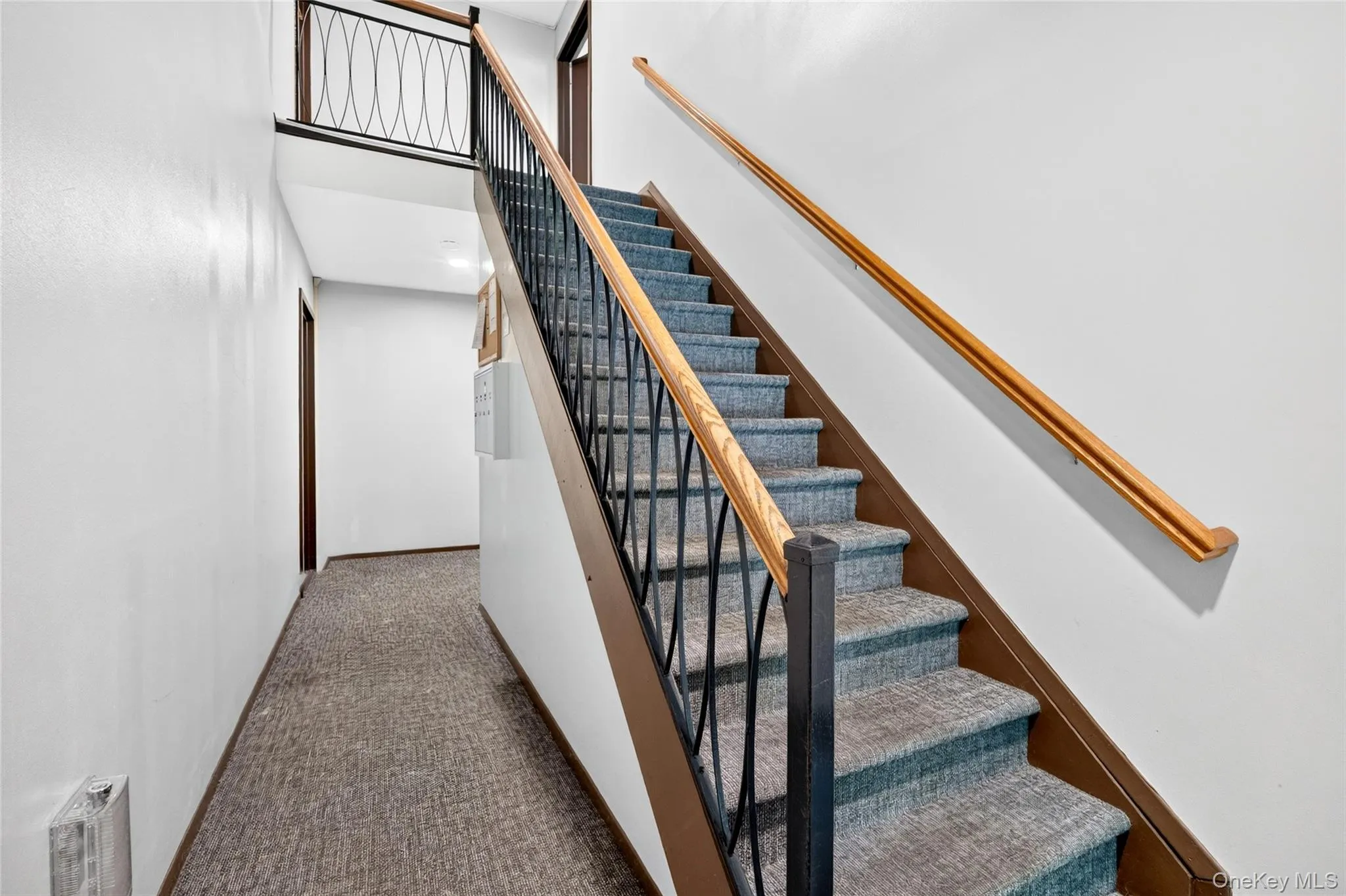 Interior staircase leading to the unit. Interior staircase leading to the unit.