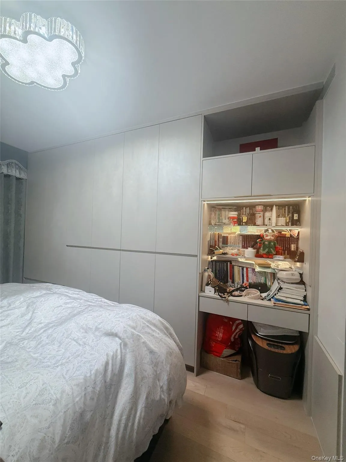 Bedroom with light wood finished floors Bedroom with light wood finished floors