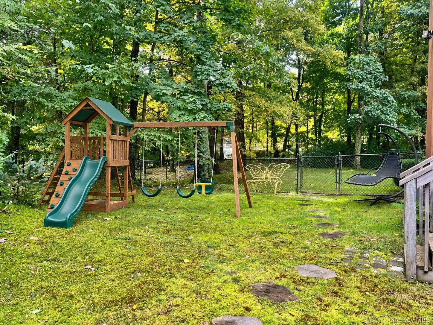 Virtually Staged Side Yard With Swing Set Virtually Staged Side Yard With Swing Set