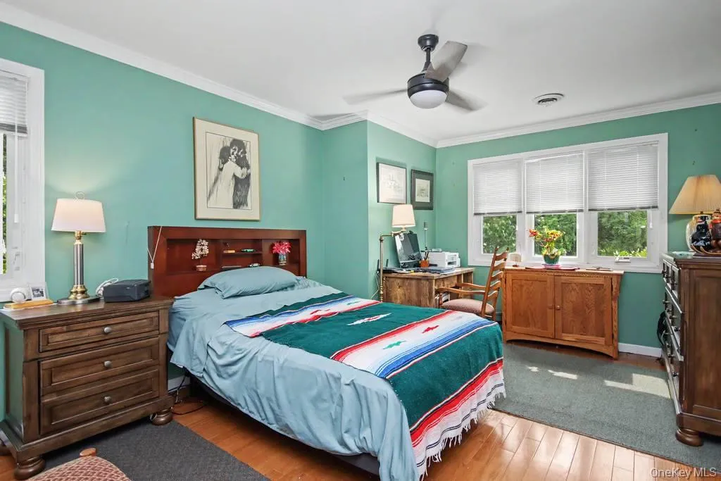 First floor bedroom has ceiling fan with light First floor bedroom has ceiling fan with light