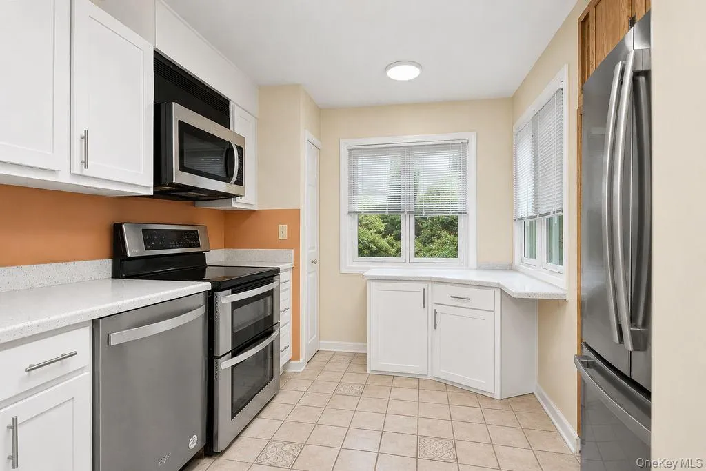 Updated Kitchen featuring quartz counters and new cabinetry Updated Kitchen featuring quartz counters and new cabinetry