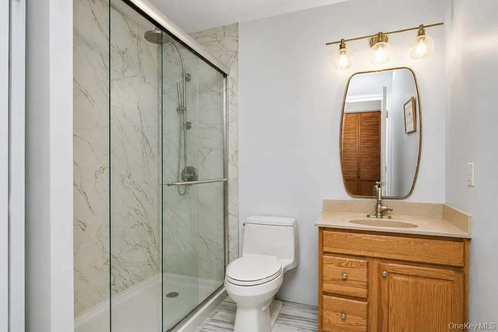 Bathroom with oversized stall shower and sink with vanity Bathroom with oversized stall shower and sink with vanity