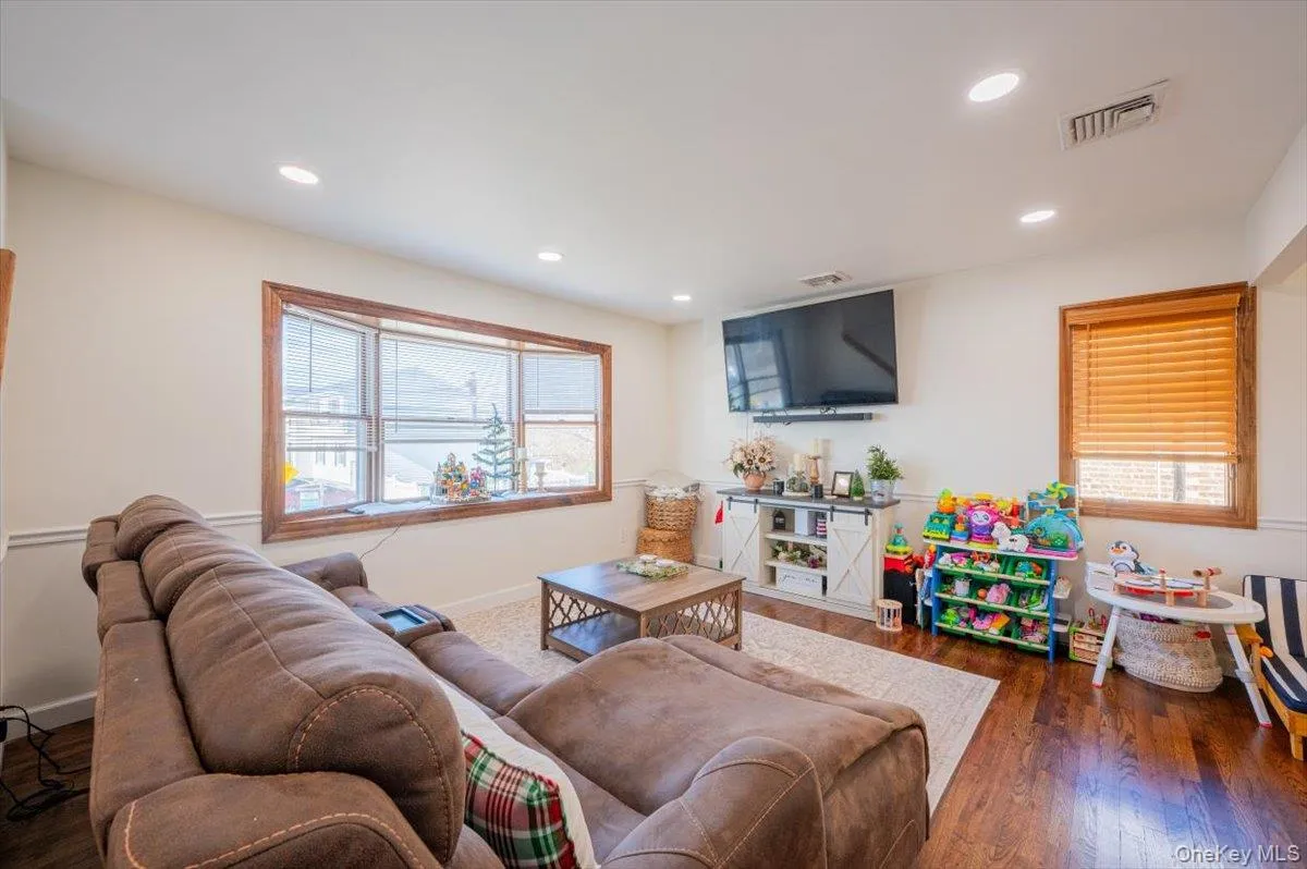 Living room featuring dark hardwood / wood-style floors Living room featuring dark hardwood / wood-style floors