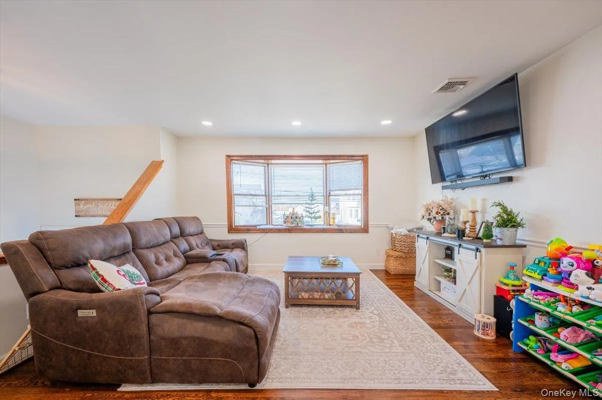 Living room with dark hardwood / wood-style floors Living room with dark hardwood / wood-style floors