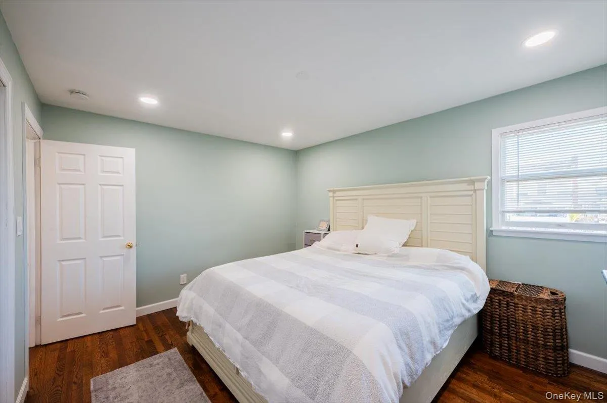 Bedroom with dark wood-type flooring Bedroom with dark wood-type flooring
