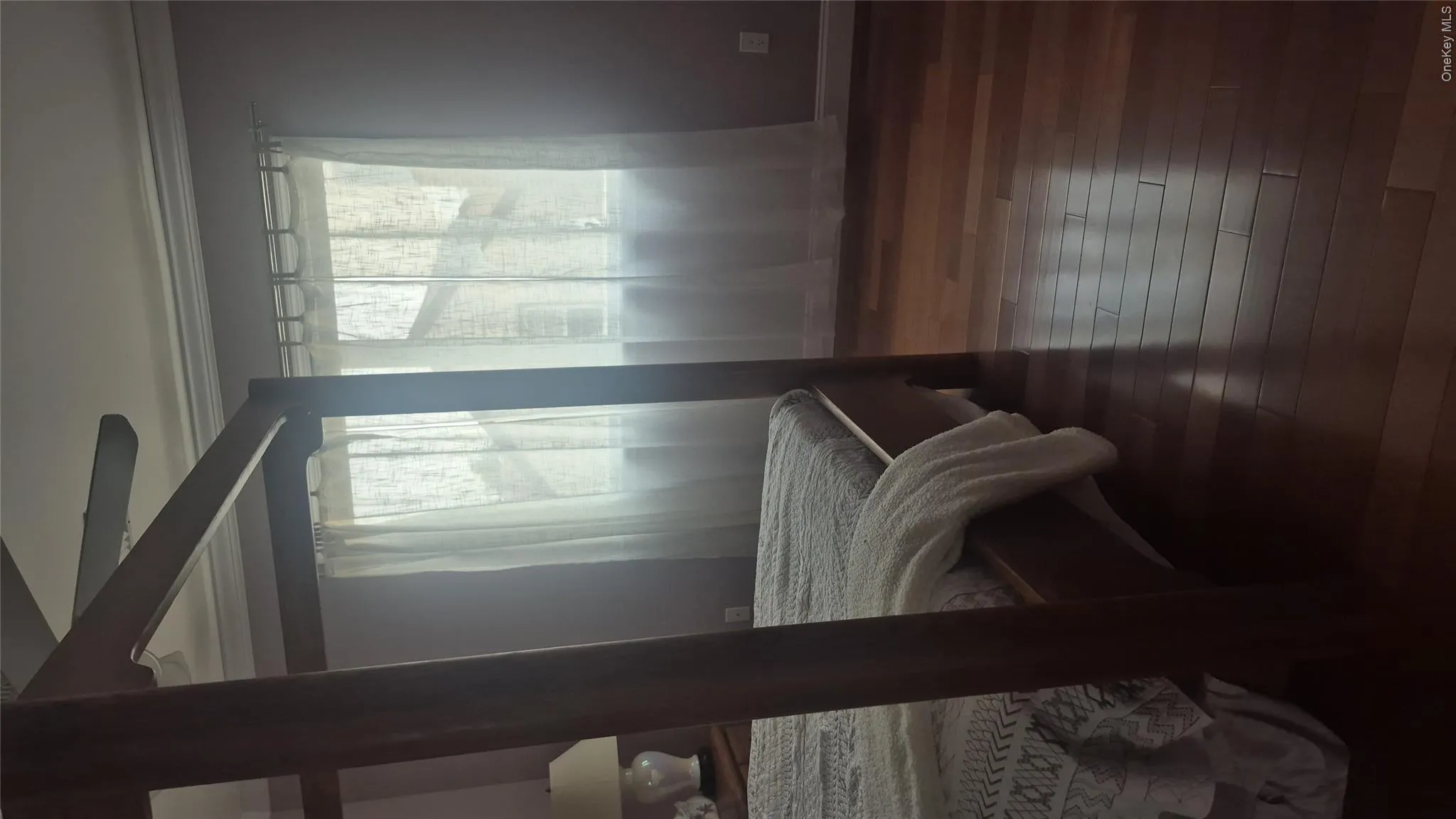 Hardwood flooring, crown molding, large window, closet and a ceiling fan Hardwood flooring, crown molding, large window, closet and a ceiling fan
