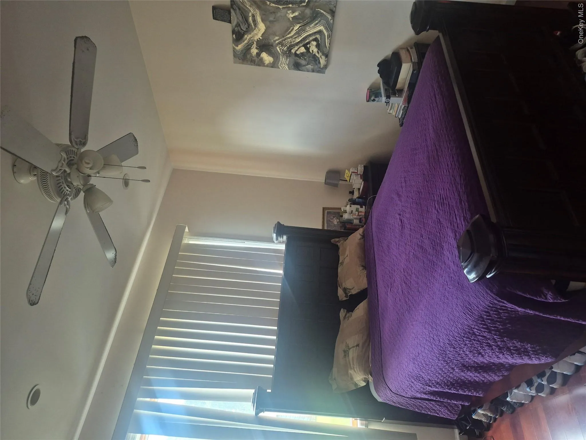 !st Floor Bedroom with wood flooring, recessed lighting, and a ceiling fan with integrated lighting, blinds and large window !st Floor Bedroom with wood flooring, recessed lighting, and a ceiling fan with integrated lighting, blinds and large window