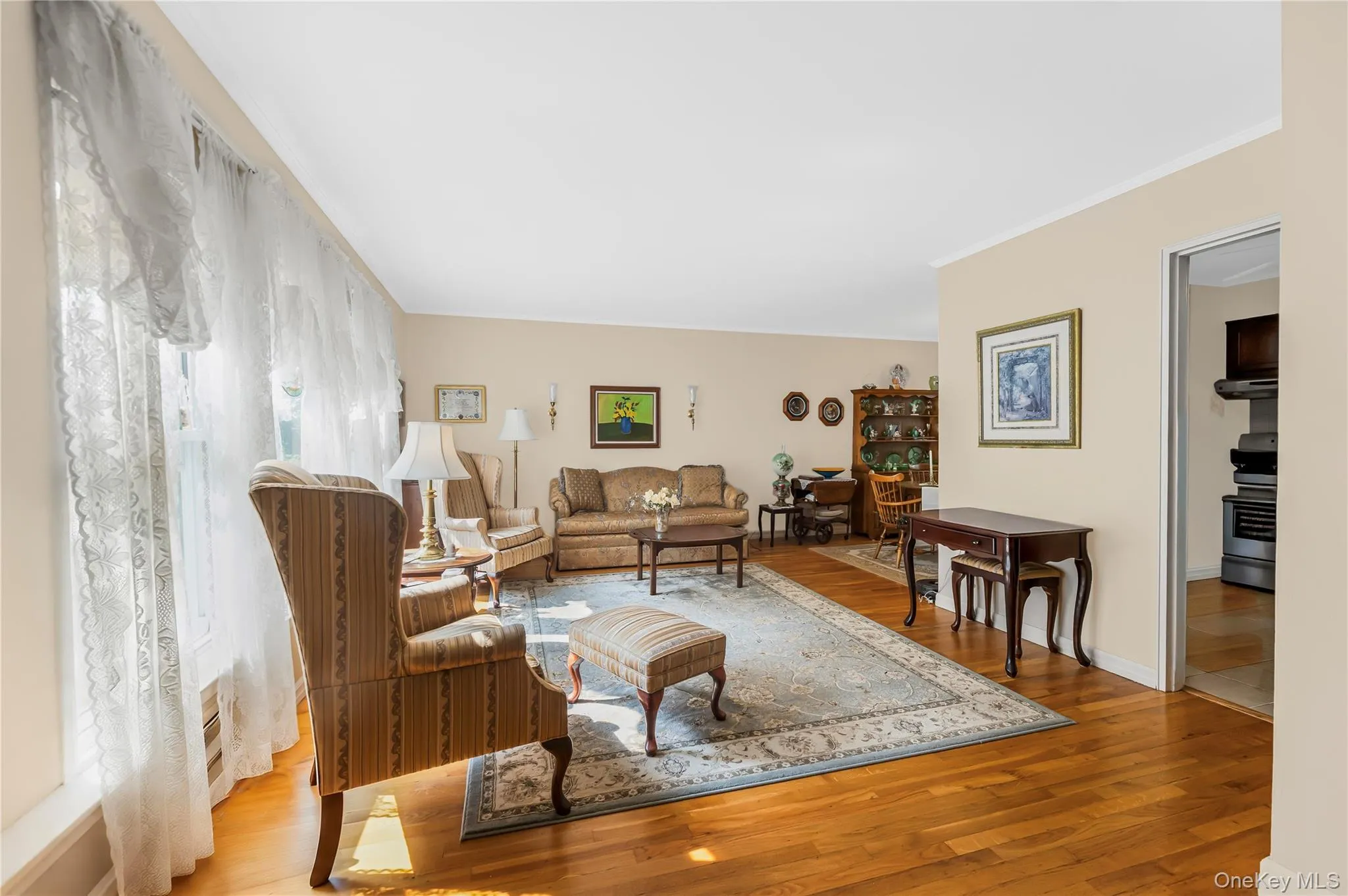 Hardwood flooring throughout, recessed lighting, and neutral wall tones Hardwood flooring throughout, recessed lighting, and neutral wall tones