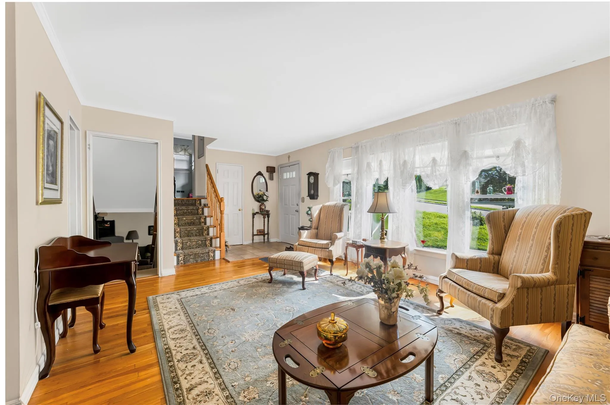 Hardwood flooring throughout, recessed lighting, and neutral wall tones Hardwood flooring throughout, recessed lighting, and neutral wall tones