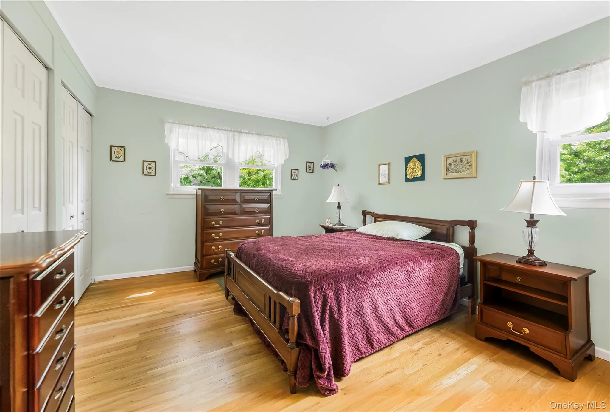 Wood-finish flooring, light-toned walls, and white trim work Wood-finish flooring, light-toned walls, and white trim work