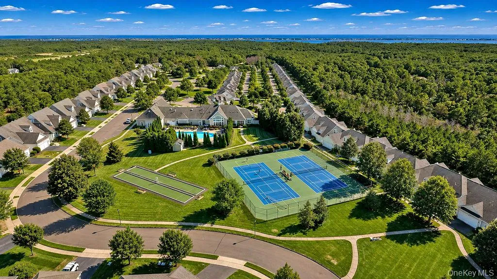 Community tennis/pickle ball court, bocce court and recreation area. Community tennis/pickle ball court, bocce court and recreation area.