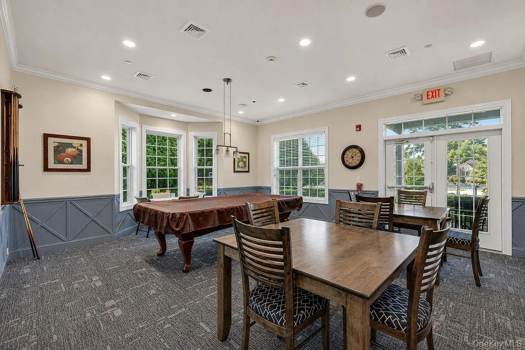 Clubhouse game room with Billiards and table seating Clubhouse game room with Billiards and table seating