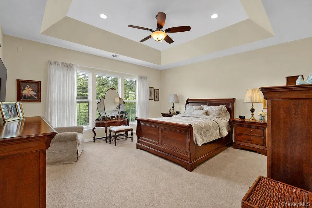 Primary bedroom: Spacious primary suite with tray ceiling and abundant natural light Primary bedroom: Spacious primary suite with tray ceiling and abundant natural light