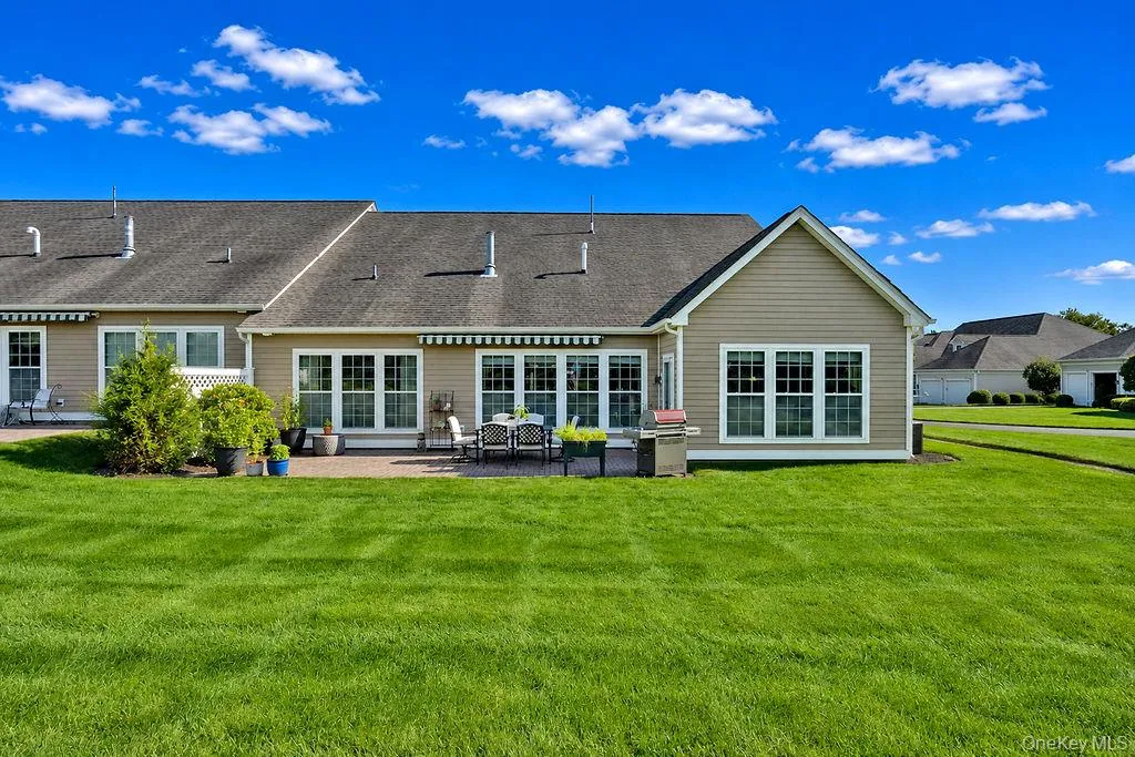 Expansive rear lawn with a peaceful, private setting Expansive rear lawn with a peaceful, private setting
