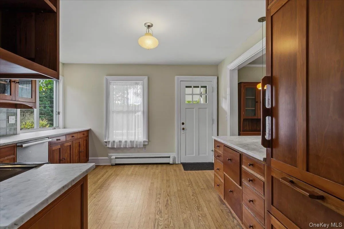 Carrara marble countertops, custom-made cabinetry Carrara marble countertops, custom-made cabinetry