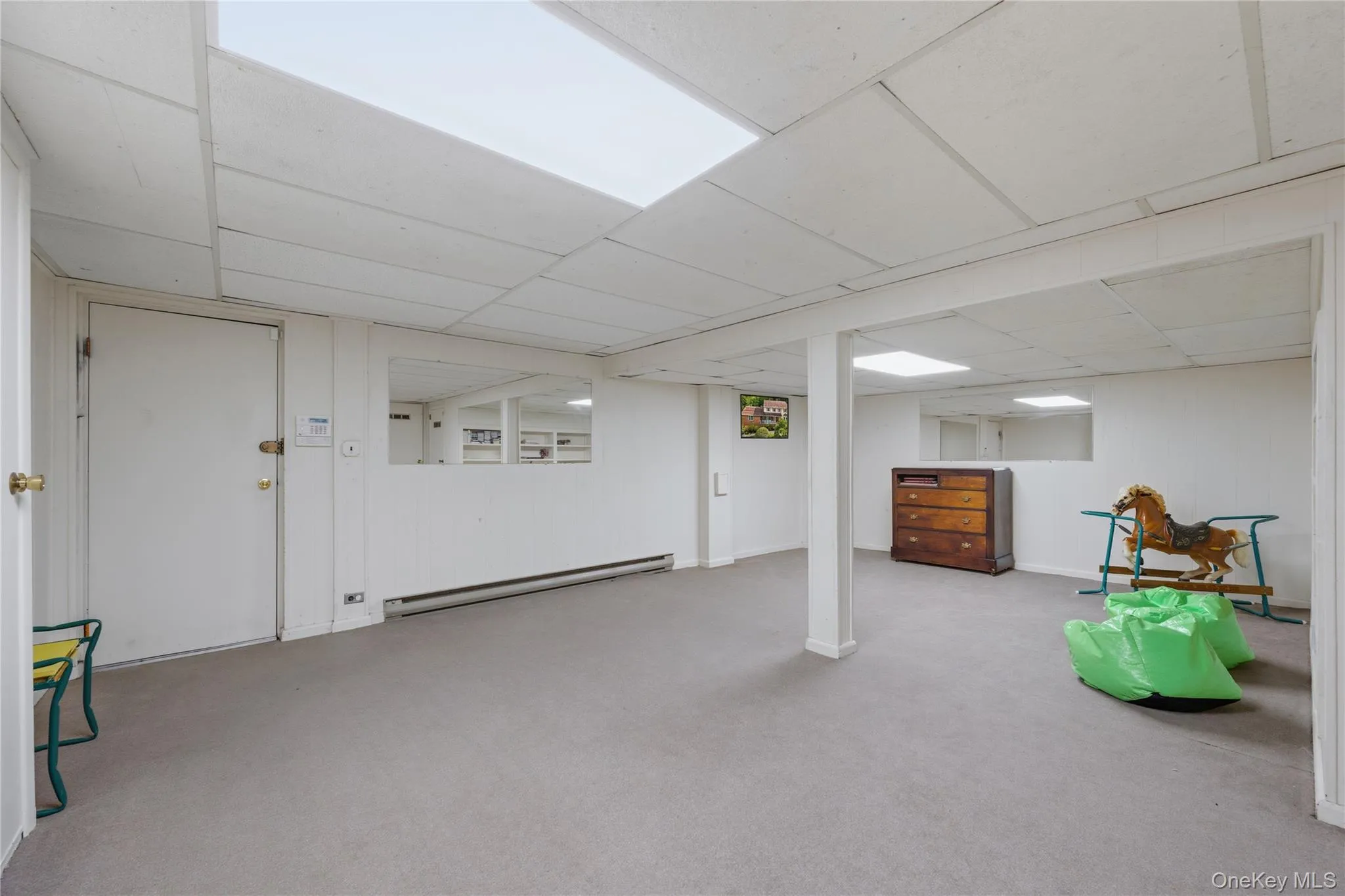 The other side of the Basement with plenty of storage room/shelves and closets. Mechanicals located in basement. Door leads to 2-car garage. The other side of the Basement with plenty of storage room/shelves and closets. Mechanicals located in basement. Door leads to 2-car garage.