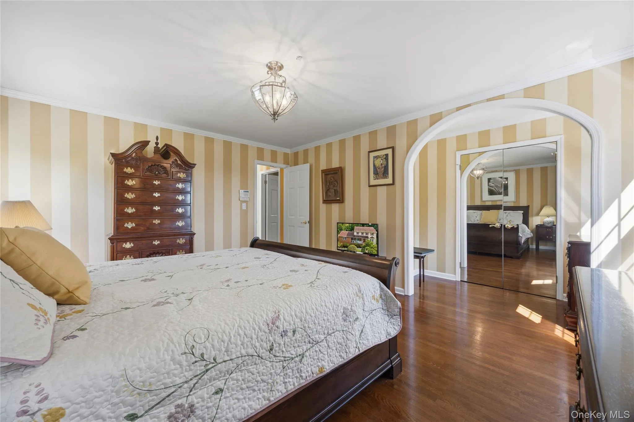 Huge walk-in closet in this bedroom and an archway to dressing area and additional mirrored closet! Huge walk-in closet in this bedroom and an archway to dressing area and additional mirrored closet!