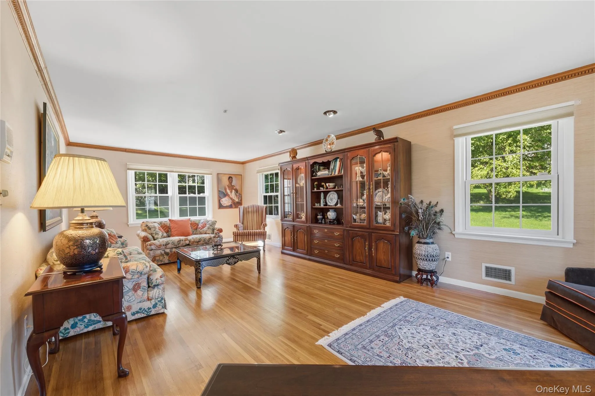 Additional view of Living Room with pristine hardwood floors and nature views all around Additional view of Living Room with pristine hardwood floors and nature views all around