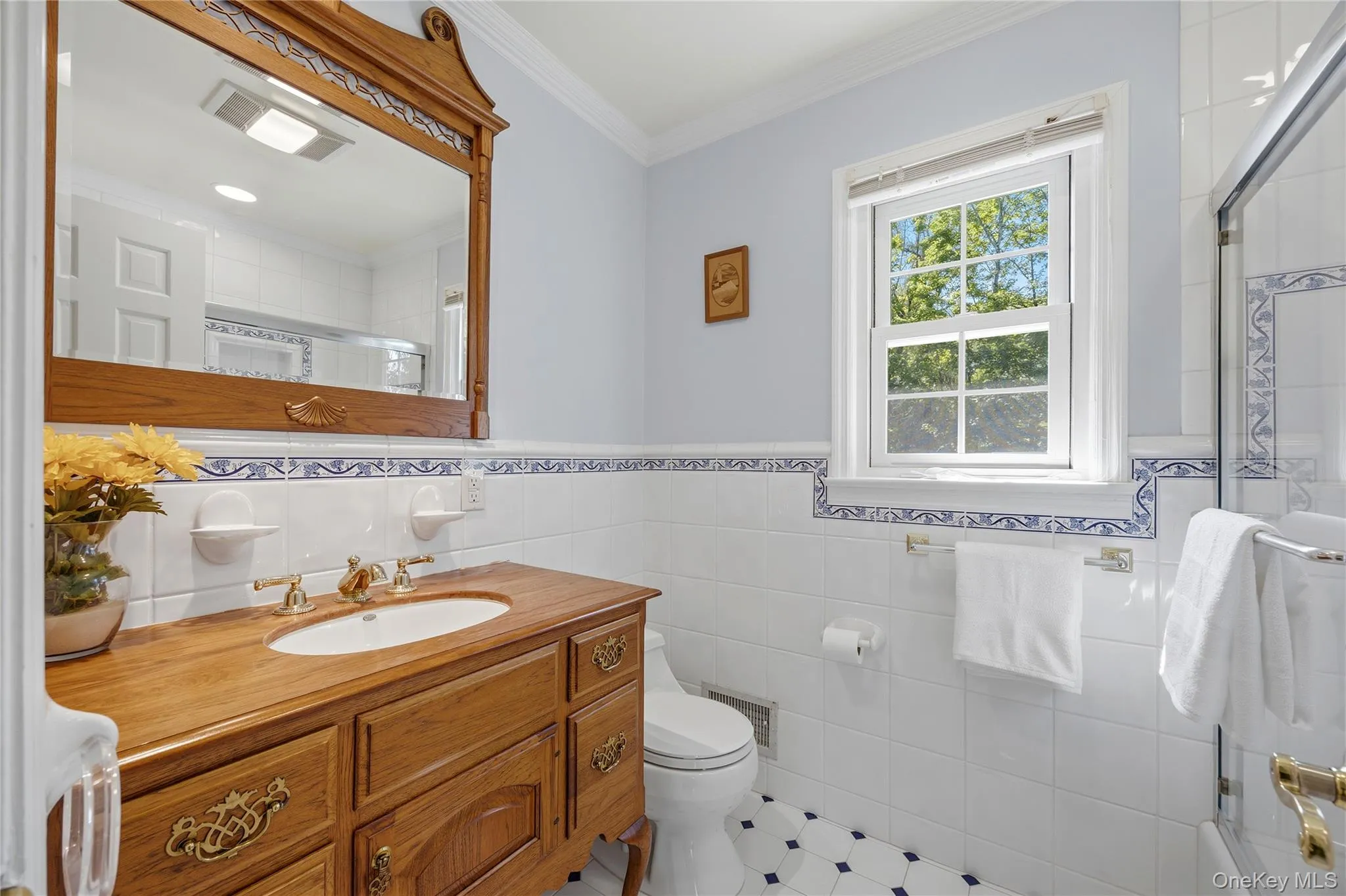 Upstairs tiled Primary Bathroom with bathtub and wood sink vanity Upstairs tiled Primary Bathroom with bathtub and wood sink vanity