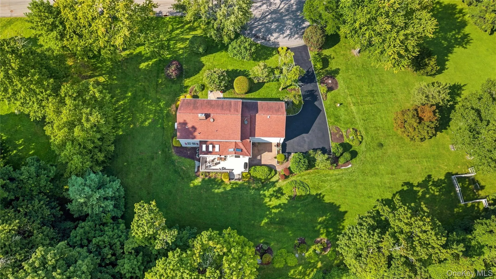 Before we step inside, you can appreciate this aerial view of your 1.5+ acre property with so much house and useable land plus a newly paved driveway (August 2026). Before we step inside, you can appreciate this aerial view of your 1.5+ acre property with so much house and useable land plus a newly paved driveway (August 2026).