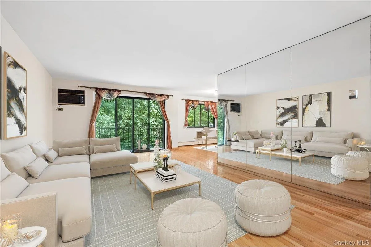 Living room view 3 - leading to balcony and dining area, virtually staged Living room view 3 - leading to balcony and dining area, virtually staged