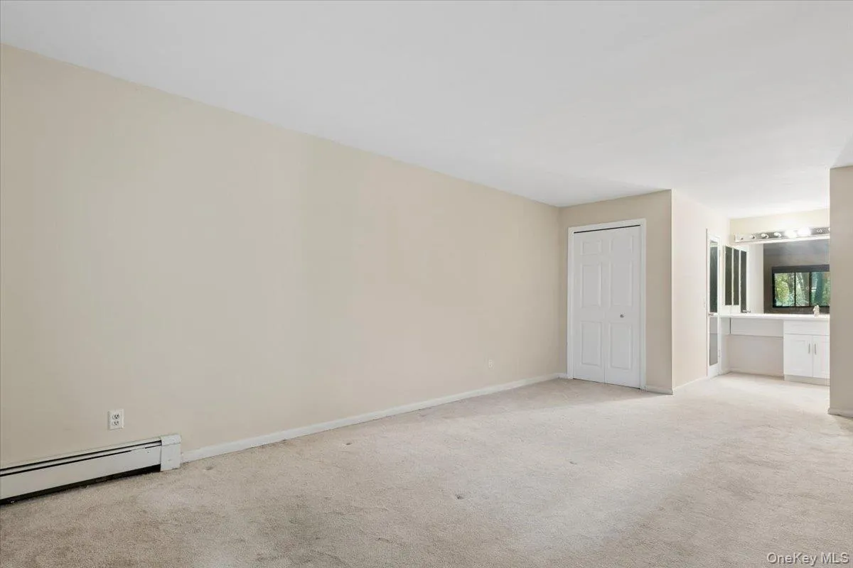 Primary bedroom view 2- leading to dressing area & bathroom Primary bedroom view 2- leading to dressing area & bathroom