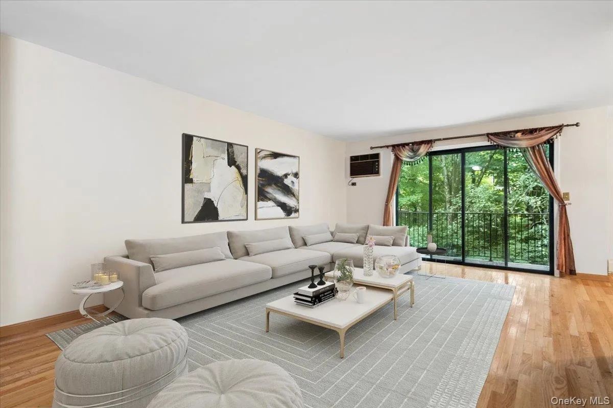 Living room view 2 - leading to balcony, virtually staged Living room view 2 - leading to balcony, virtually staged