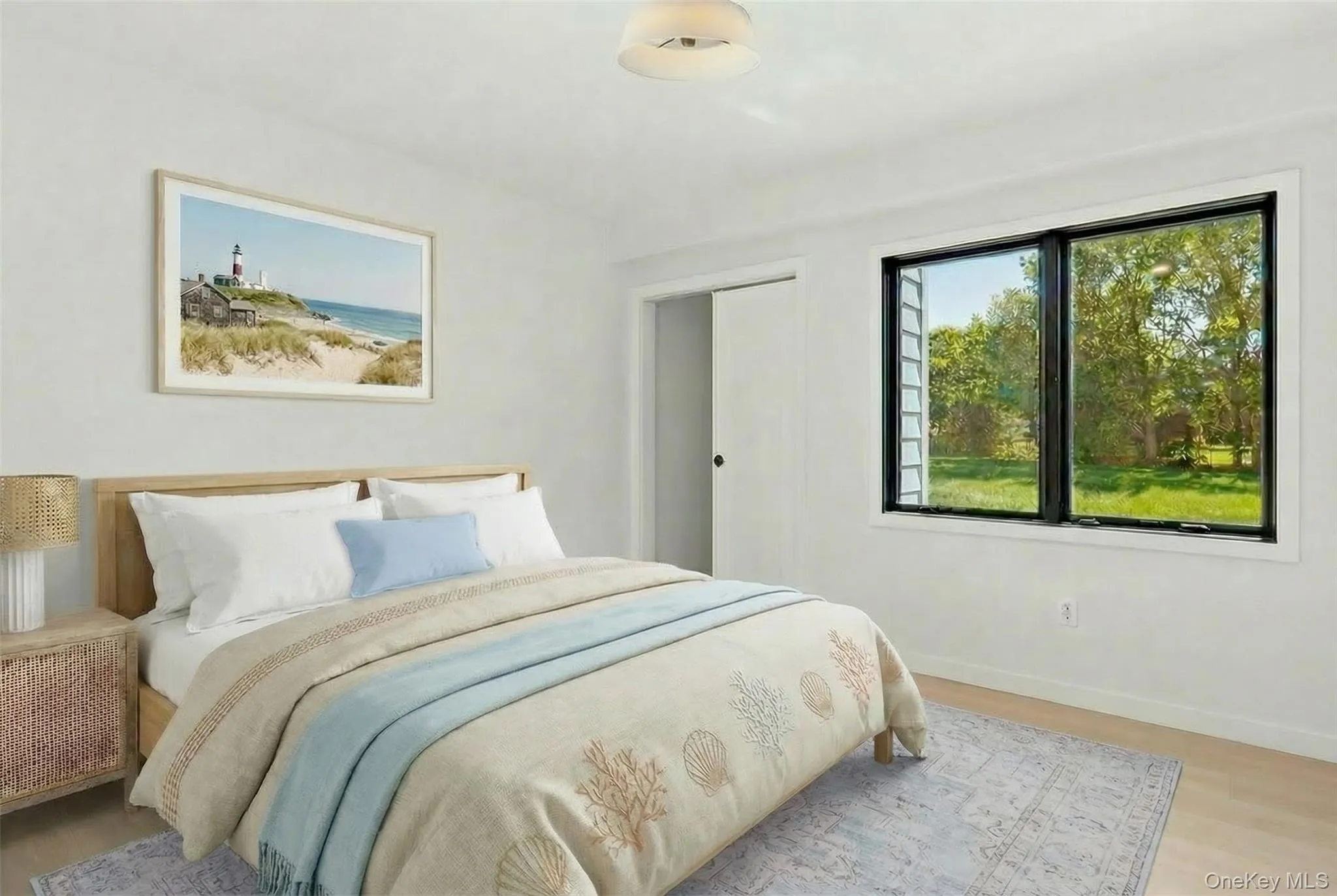 Light wood-finish flooring, white walls, and a contemporary ceiling light fixture Light wood-finish flooring, white walls, and a contemporary ceiling light fixture