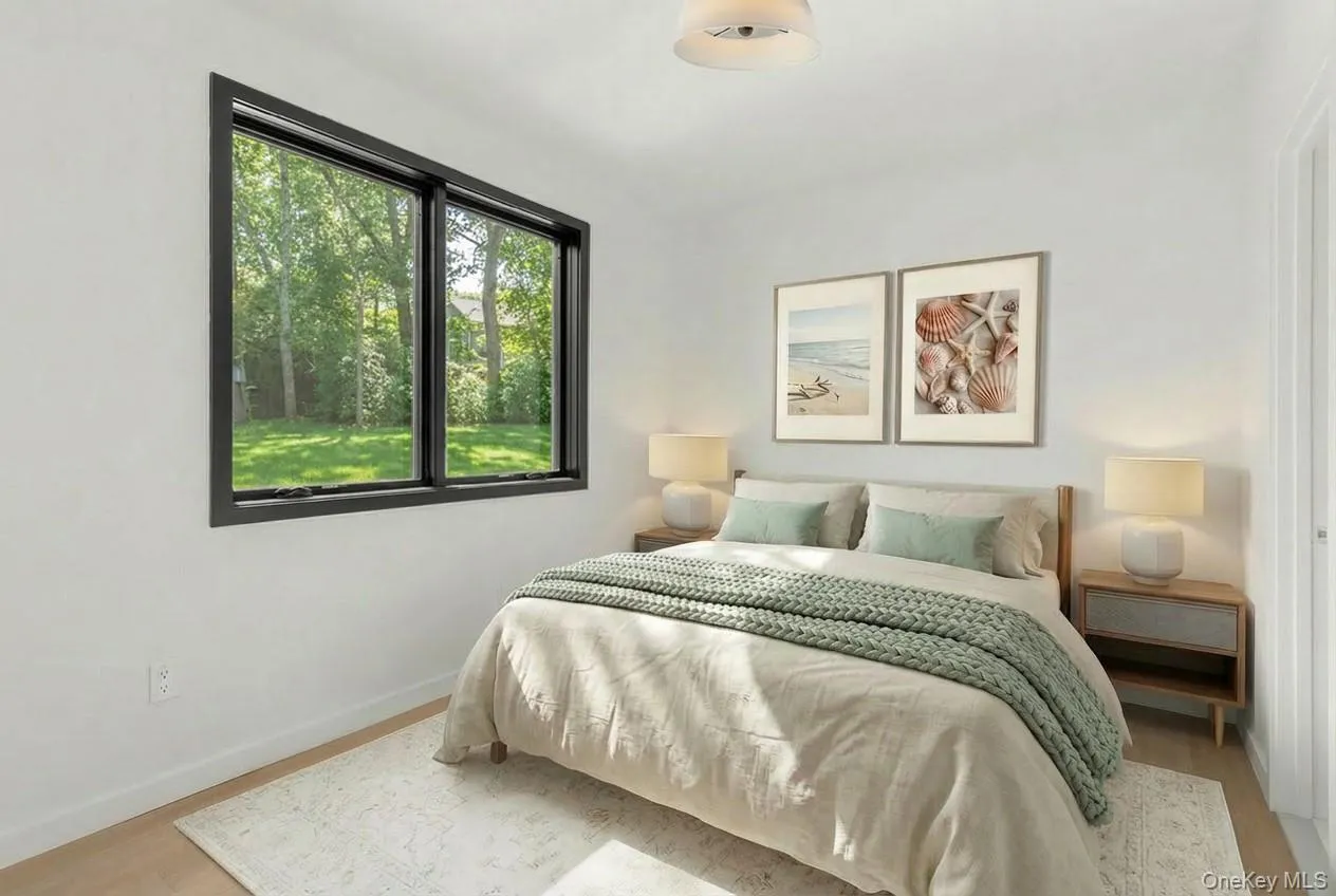 Black-framed window, flush-mount ceiling light fixture, and wood-finish flooring Black-framed window, flush-mount ceiling light fixture, and wood-finish flooring
