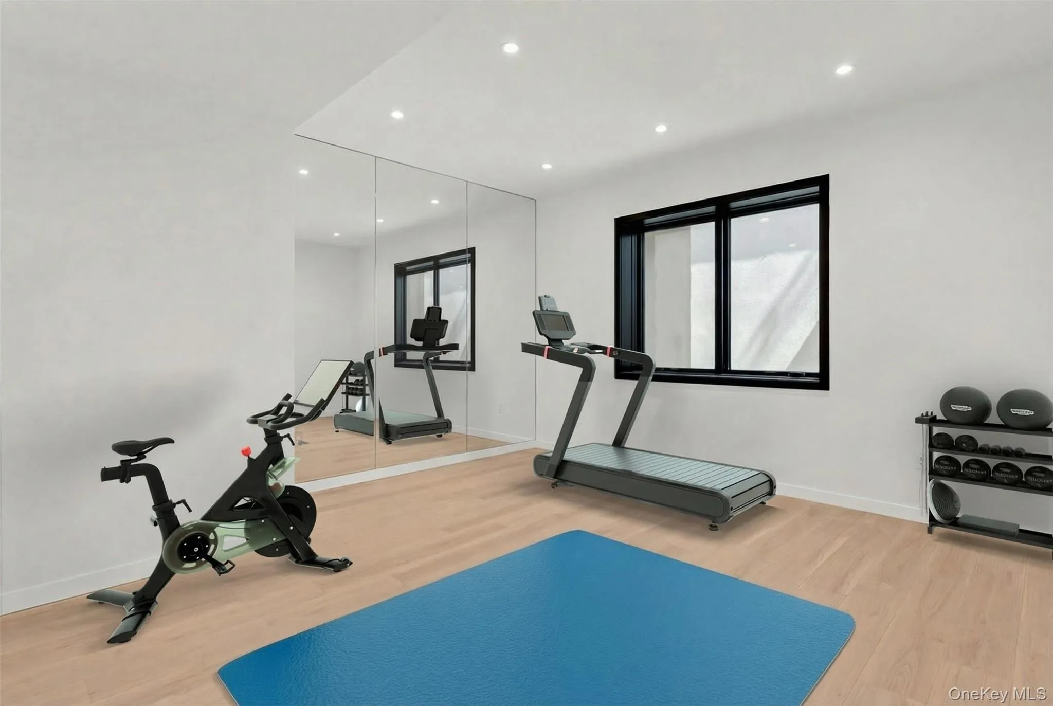 Recessed lighting, full-wall mirror installation, wood-finish flooring, white walls, and a black-framed window Recessed lighting, full-wall mirror installation, wood-finish flooring, white walls, and a black-framed window