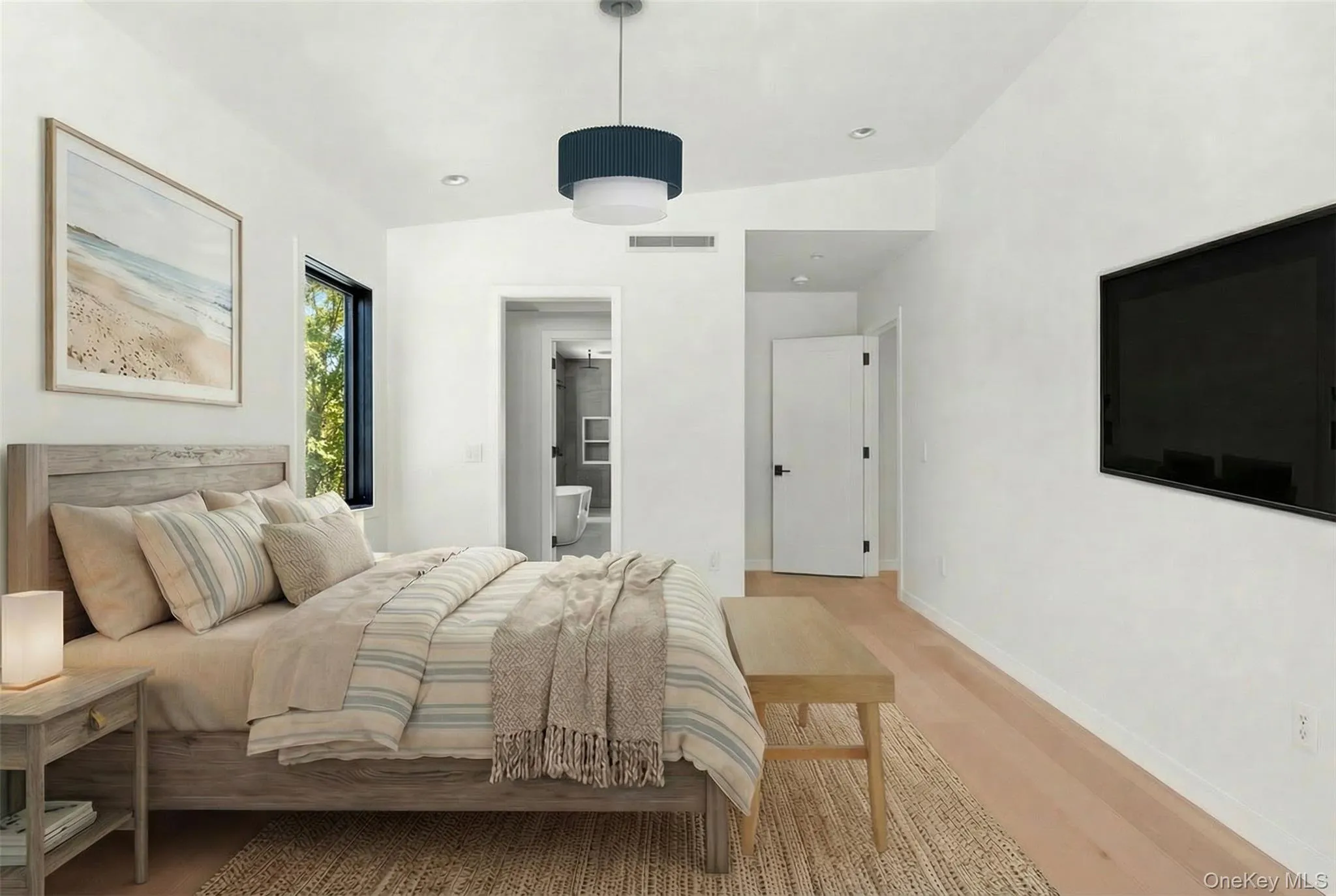 Light wood-finish flooring, a contemporary pendant light fixture, and a built-in wall-mounted television Light wood-finish flooring, a contemporary pendant light fixture, and a built-in wall-mounted television