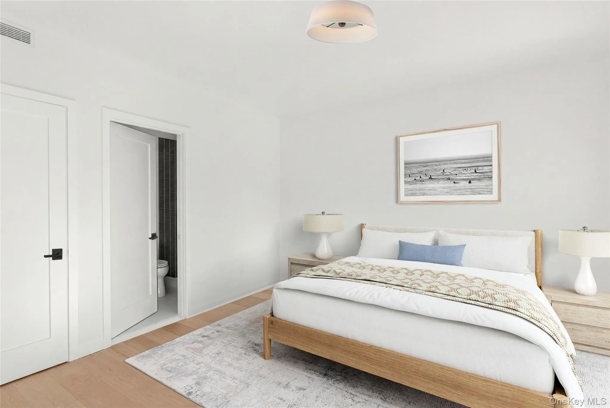 Recessed lighting, wood-finish flooring, white flat panel doors, and a ceiling-mounted light fixture Recessed lighting, wood-finish flooring, white flat panel doors, and a ceiling-mounted light fixture