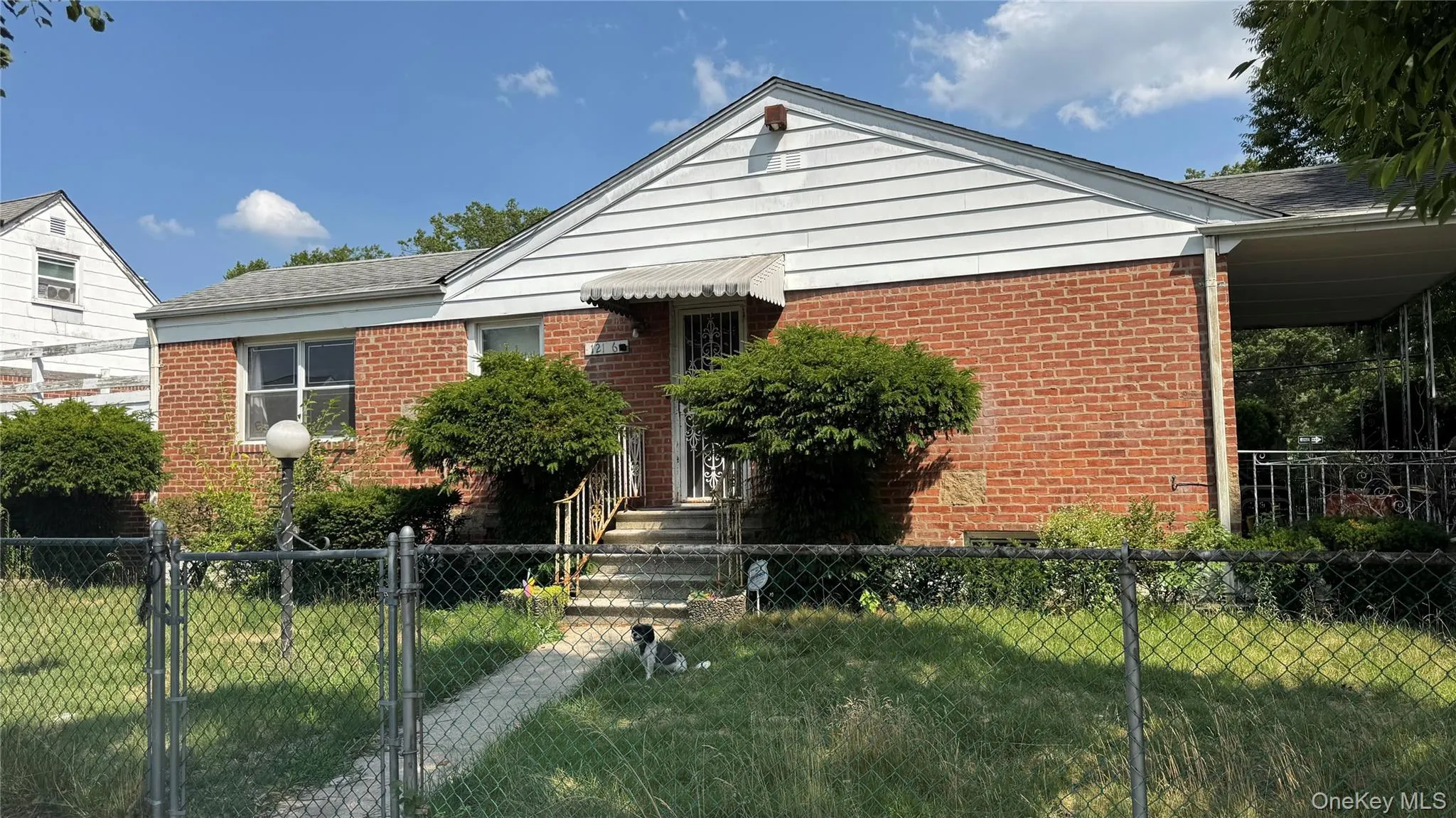 Brick and siding exterior with a covered entry Brick and siding exterior with a covered entry