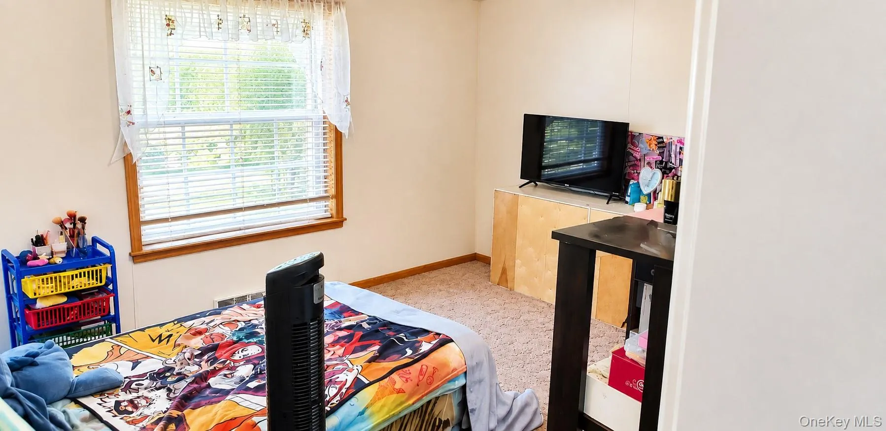 Window with blinds, wall-to-wall carpeting, light-colored walls, and a built-in wooden display stand Window with blinds, wall-to-wall carpeting, light-colored walls, and a built-in wooden display stand