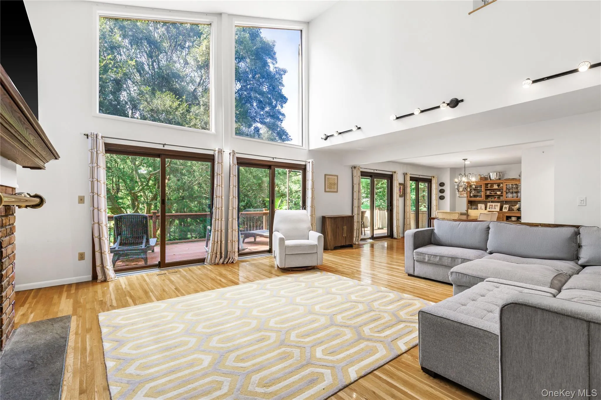 Sliding doors to deck overlooking the grounds Sliding doors to deck overlooking the grounds