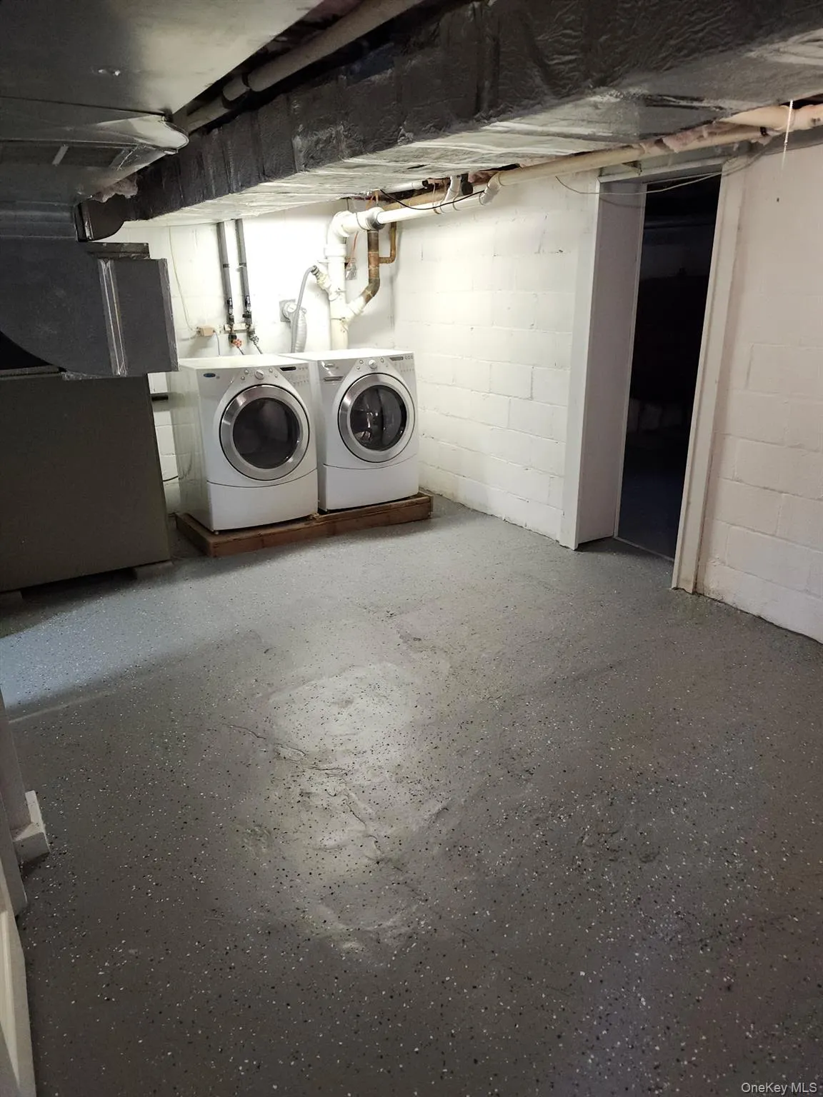 Unfinished basement featuring separate washer and dryer Unfinished basement featuring separate washer and dryer