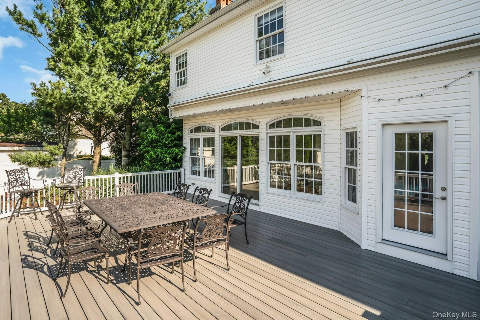 Home has awning that retracts over the deck. Home has awning that retracts over the deck.