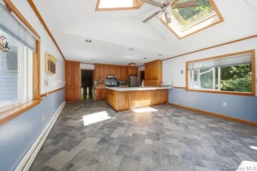 large open kitchen to eating/lounging area. skylights and large windows bring plenty of light into room. large open kitchen to eating/lounging area. skylights and large windows bring plenty of light into room.
