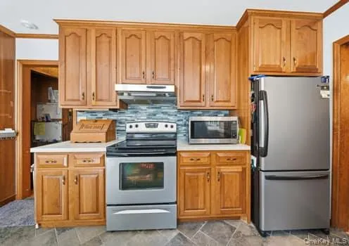Cherry wood cabinets, electric range, stainless steel referigerator Cherry wood cabinets, electric range, stainless steel referigerator