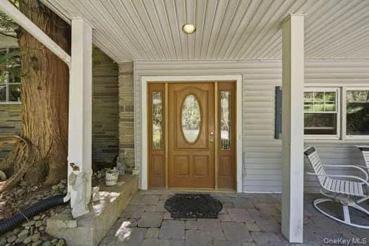 Front door with side lites. Stone walkway Front door with side lites. Stone walkway