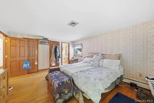 large primary bedroom with 2 closets and full bathroom large primary bedroom with 2 closets and full bathroom