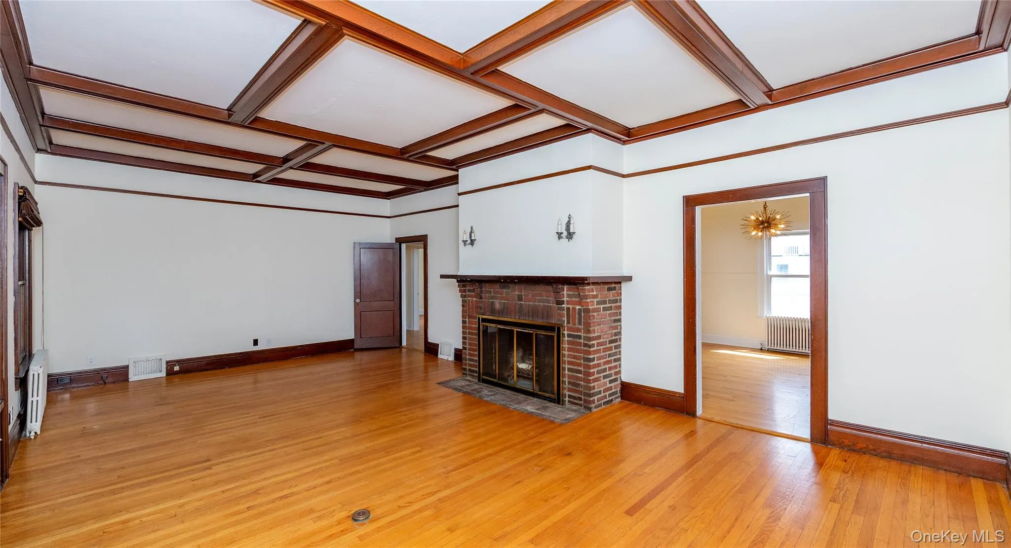 From the dining room, the door on the right leads to the expansive living room. From the dining room, the door on the right leads to the expansive living room.
