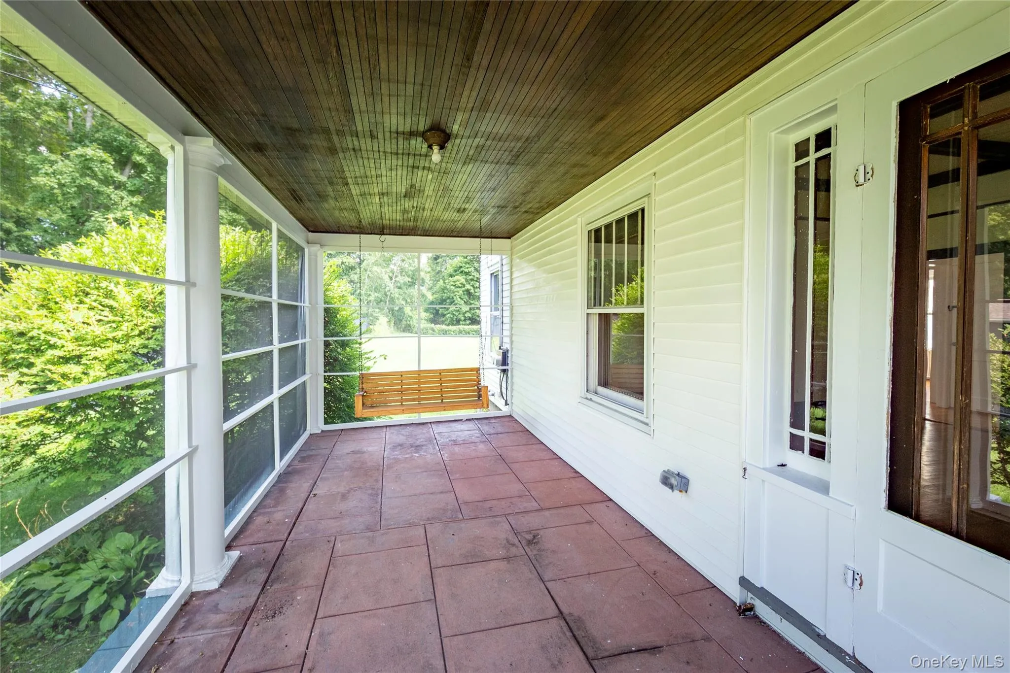 Fabulous porch swing and plenty of room for a patio set to dine alfresco. Fabulous porch swing and plenty of room for a patio set to dine alfresco.