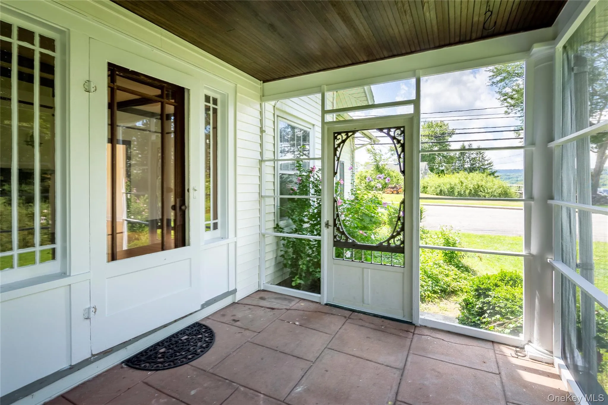 Screened porch allows for easy access to the side yard and to the parking area. Screened porch allows for easy access to the side yard and to the parking area.