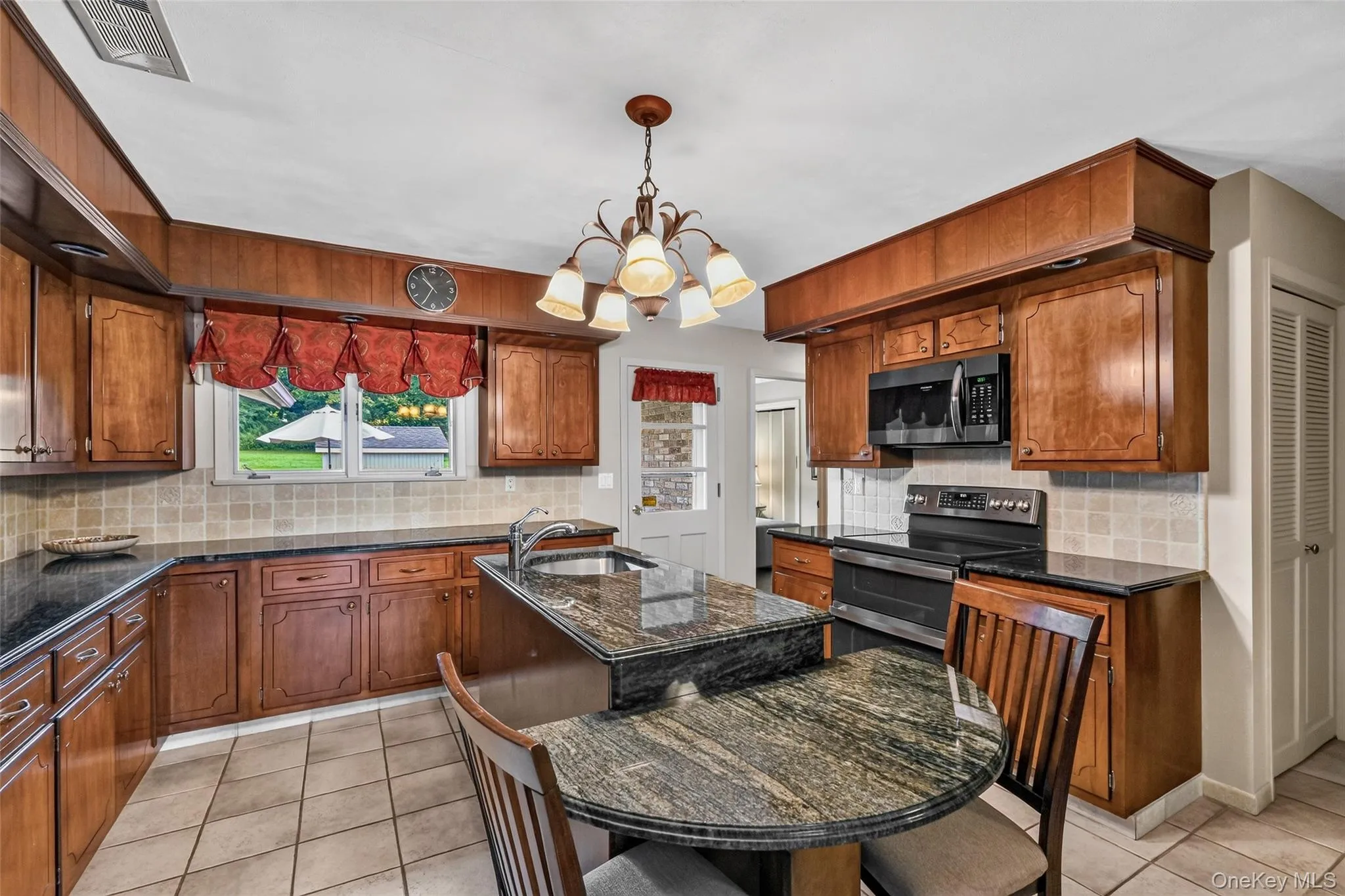 Original walnut cabinets, granite counters, stainless steel appliances Original walnut cabinets, granite counters, stainless steel appliances