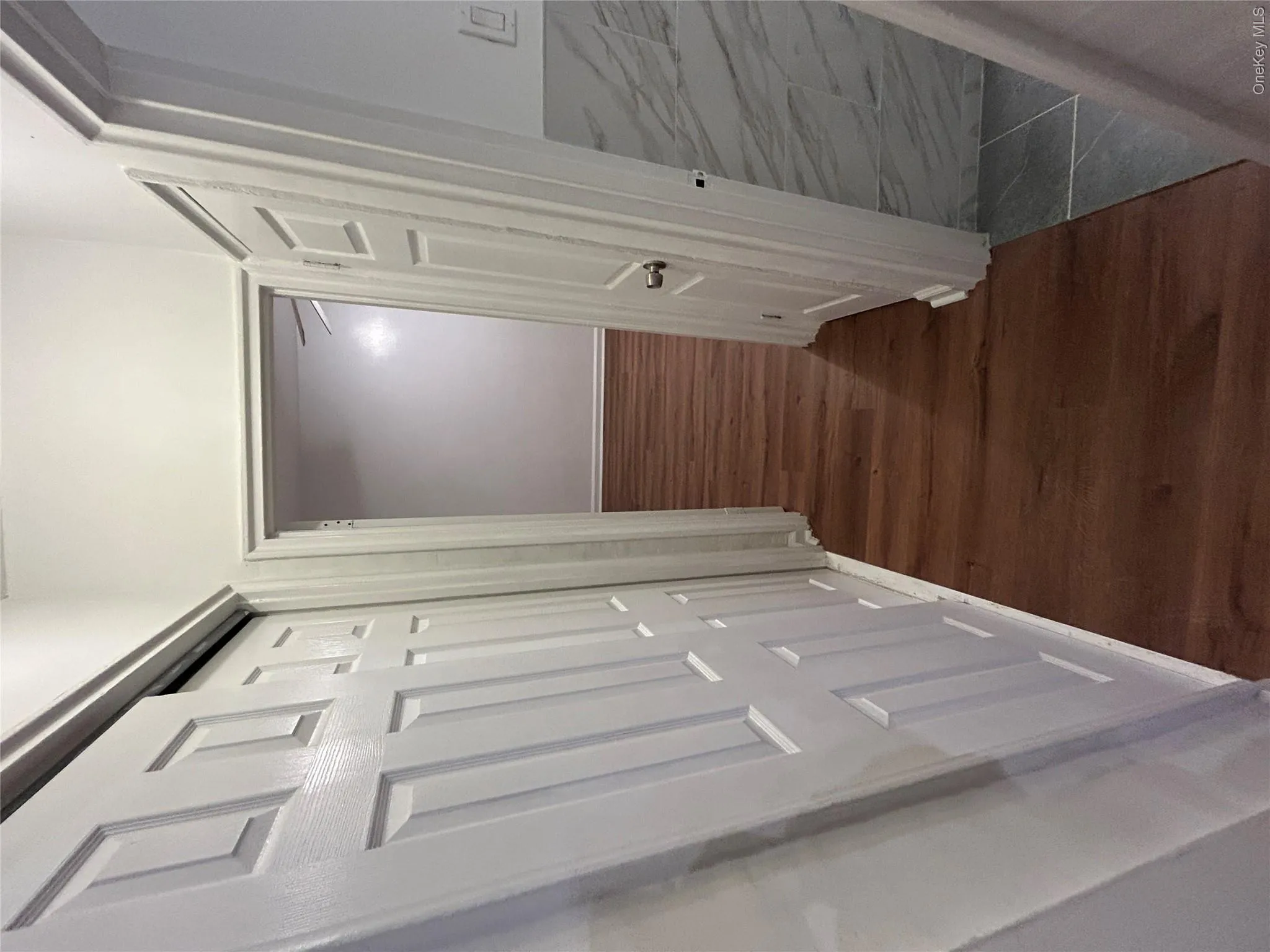 Corridor featuring dark hardwood / wood-style flooring Corridor featuring dark hardwood / wood-style flooring