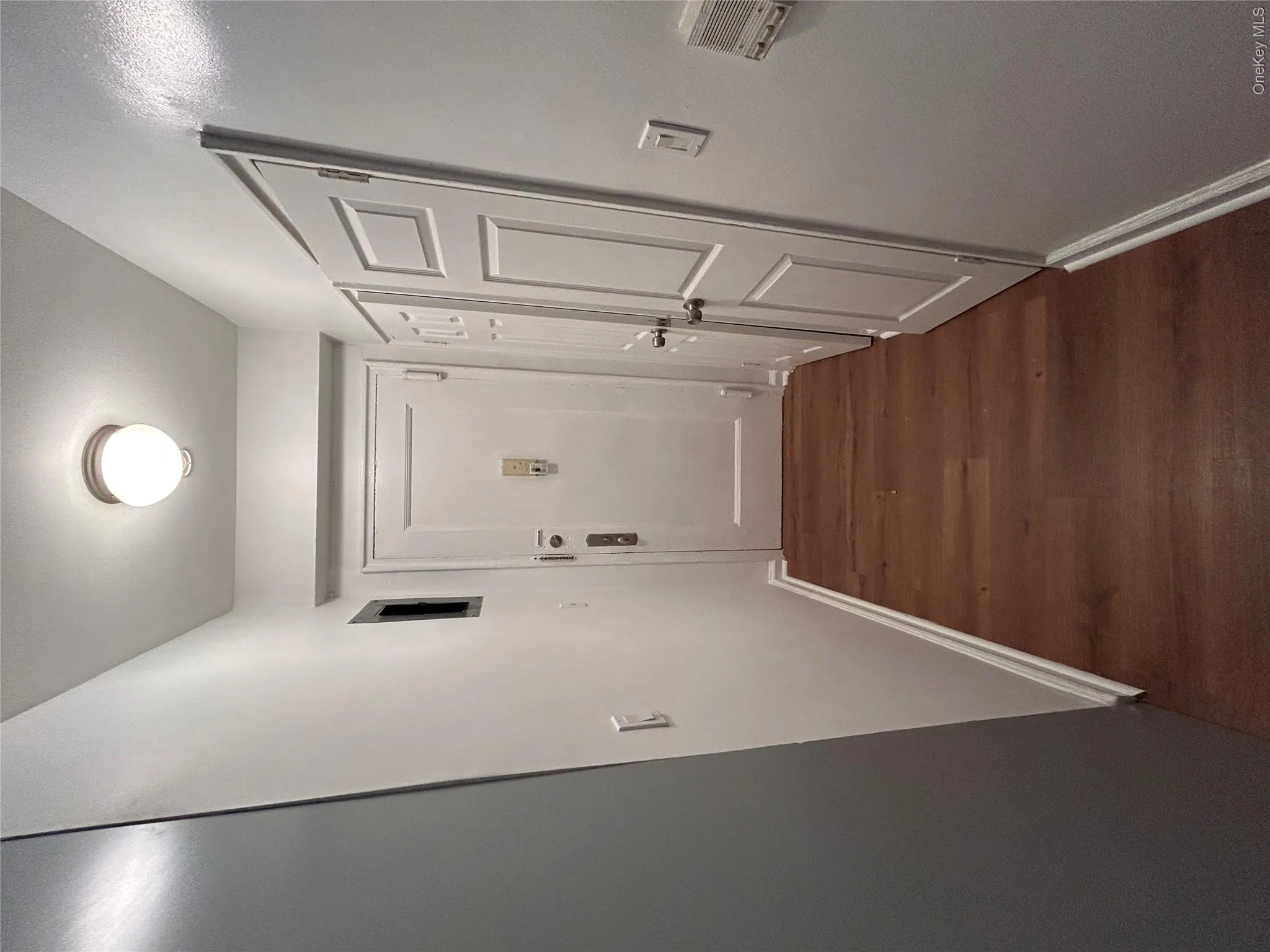 Entryway with dark wood-type flooring Entryway with dark wood-type flooring
