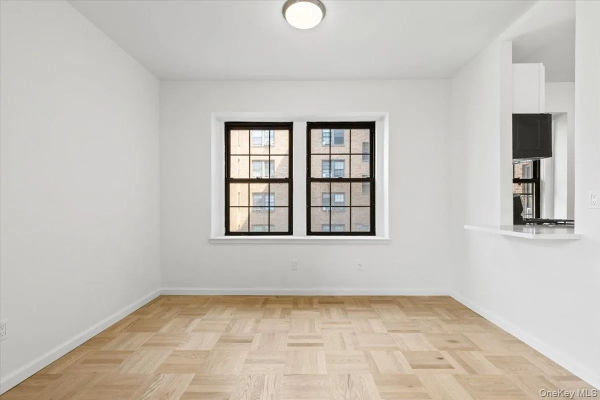 Dining Area with opening window to the Kitchen Dining Area with opening window to the Kitchen